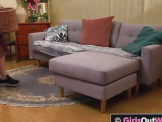 Busty redhead and blonde have lesbian sex on the sofa